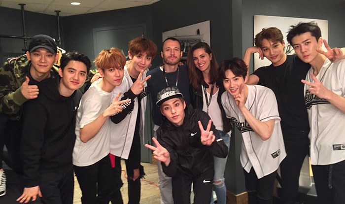 Tony Testa poses for a photo with the pop group EXO, backstage after a concert in LA. (Tony Testa)